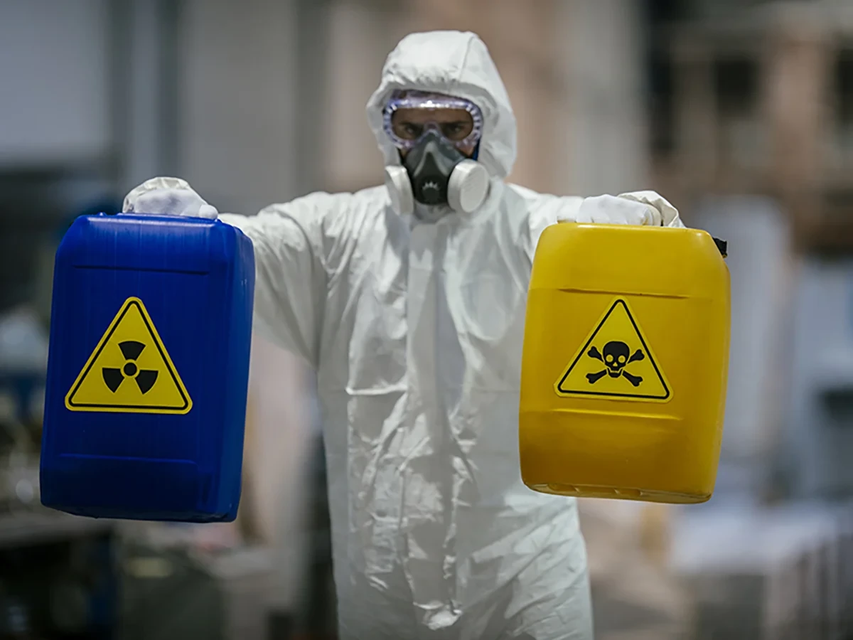 Biohazard cleanup technicians in protective equipment at a remediation scene in Oak Harbor, WA